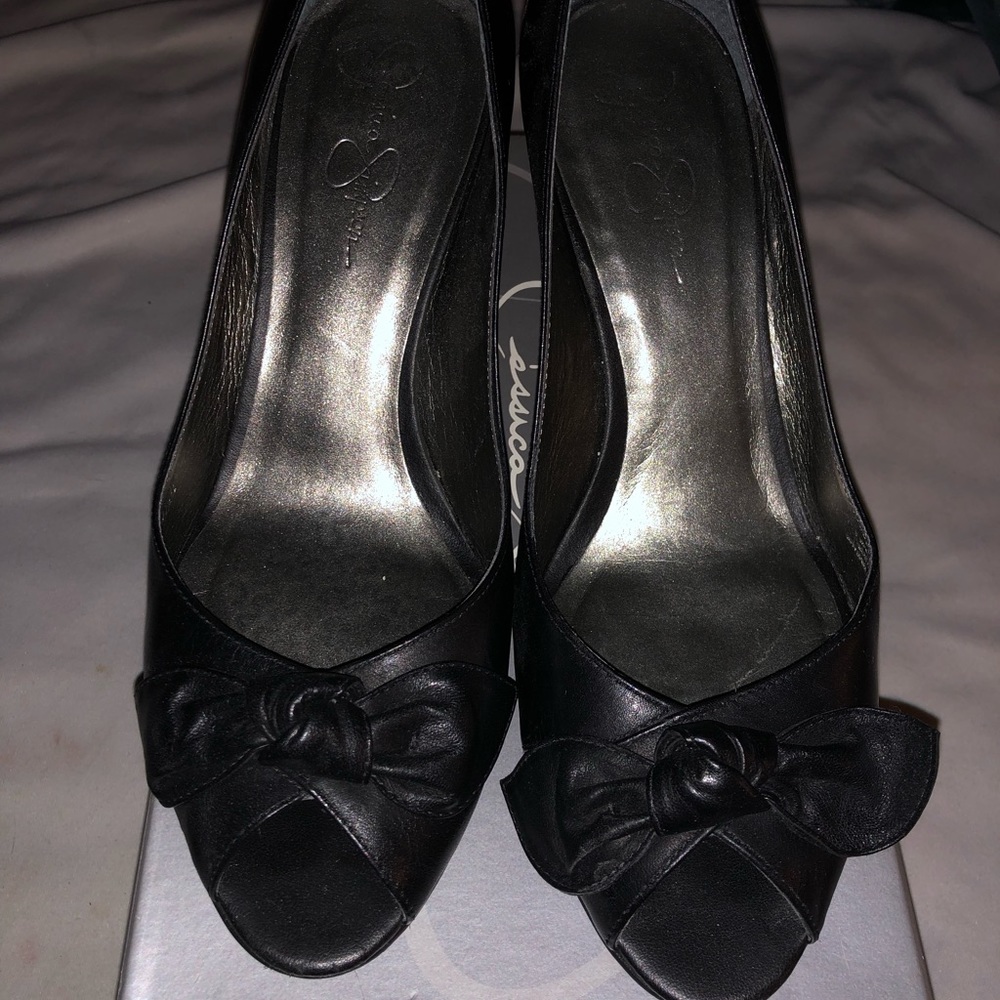Black leather pumps